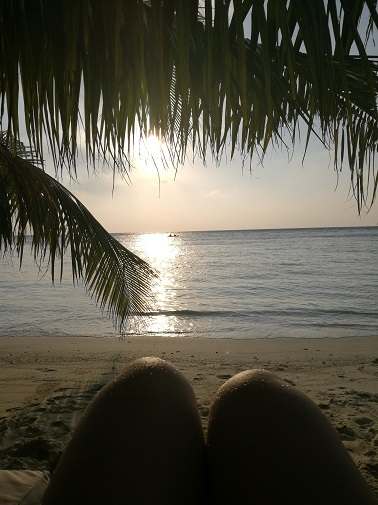 Laying on the beach and watching the sunset - one of the top things to do in the Maldives at night
